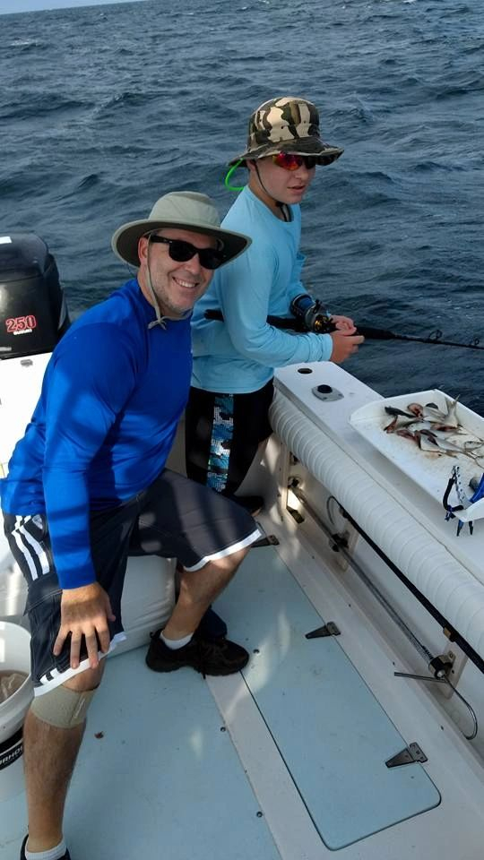 Young fisherman enjoying a family fishing charter