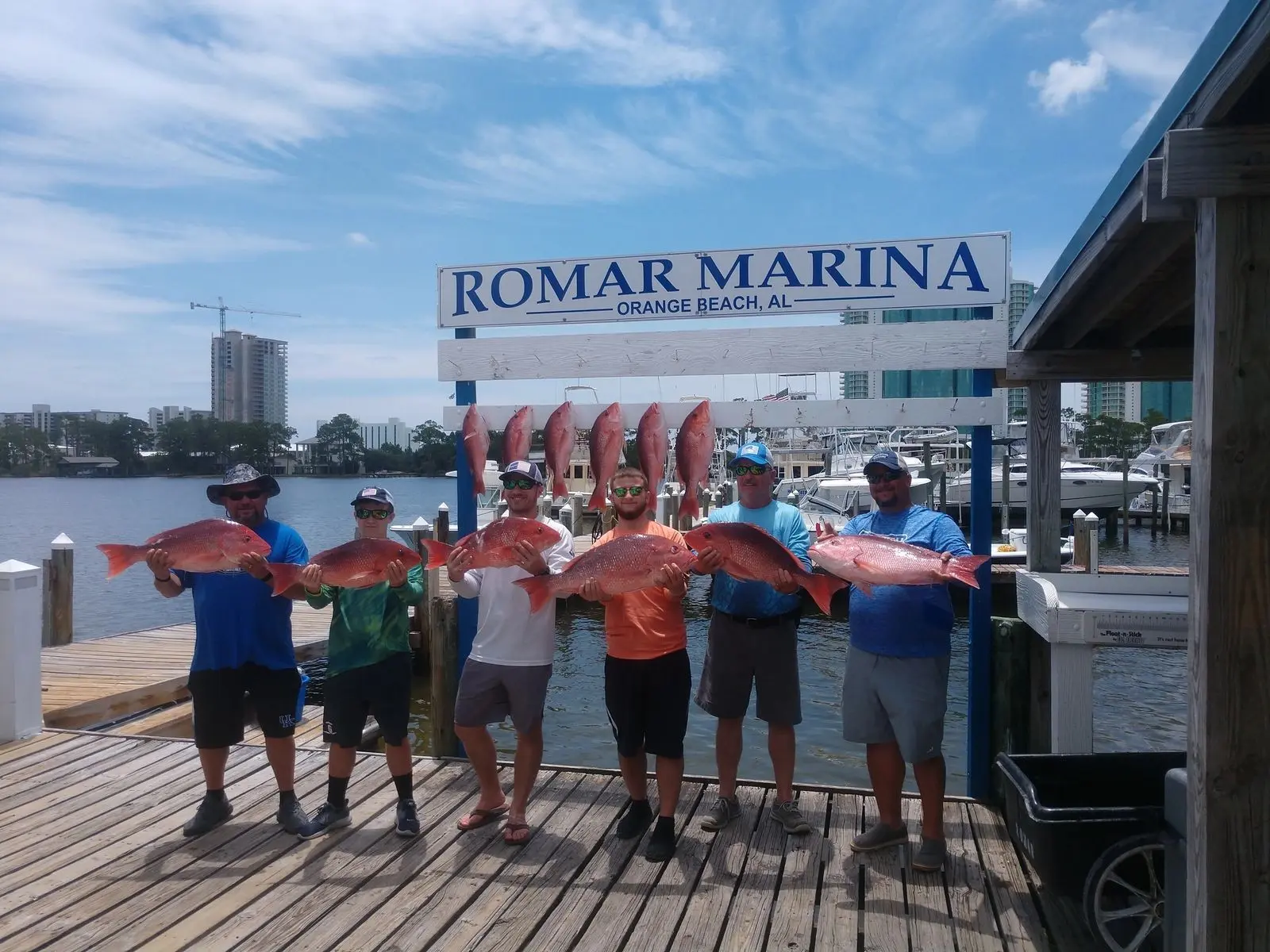 Charter group displaying a large catch at Romar Marina