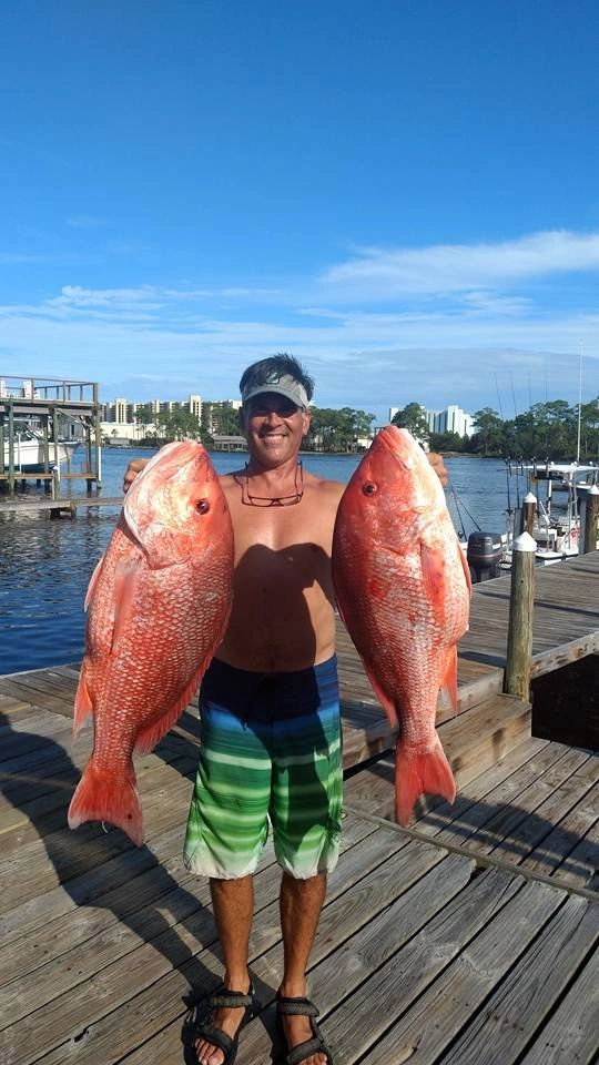 Two large red snapper caught on a Hooked Up charter